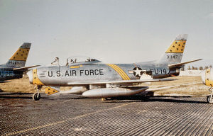 North American F-86F-35-NA Sabre Serial 53-1147 of the 21st FBW.   Note the aircraft is parked on temporary steel planking, when the parking apron of Chambley was still unfinished.    The tail of the F-86 to the left is serial 52-5263, which was destroyed in an accident 4 June 1974